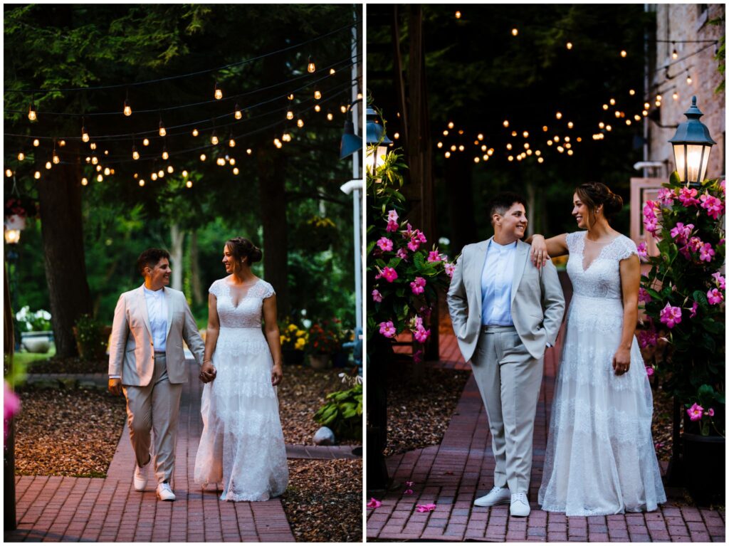 The brides stand on a lit path surrounded by flowers at the Sinclair of Skaneateles.