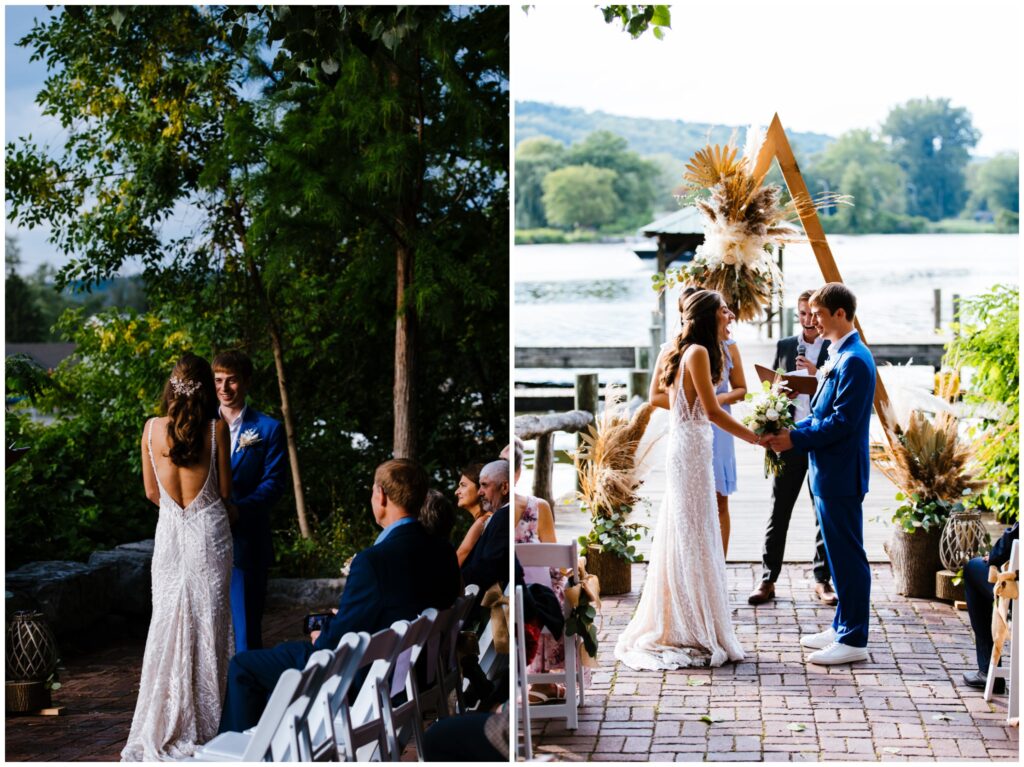 Bride and groom stand at a DIY alter with feathers and florals. They are in front of a lake in Ithaca, NY during their wedding ceremony.
