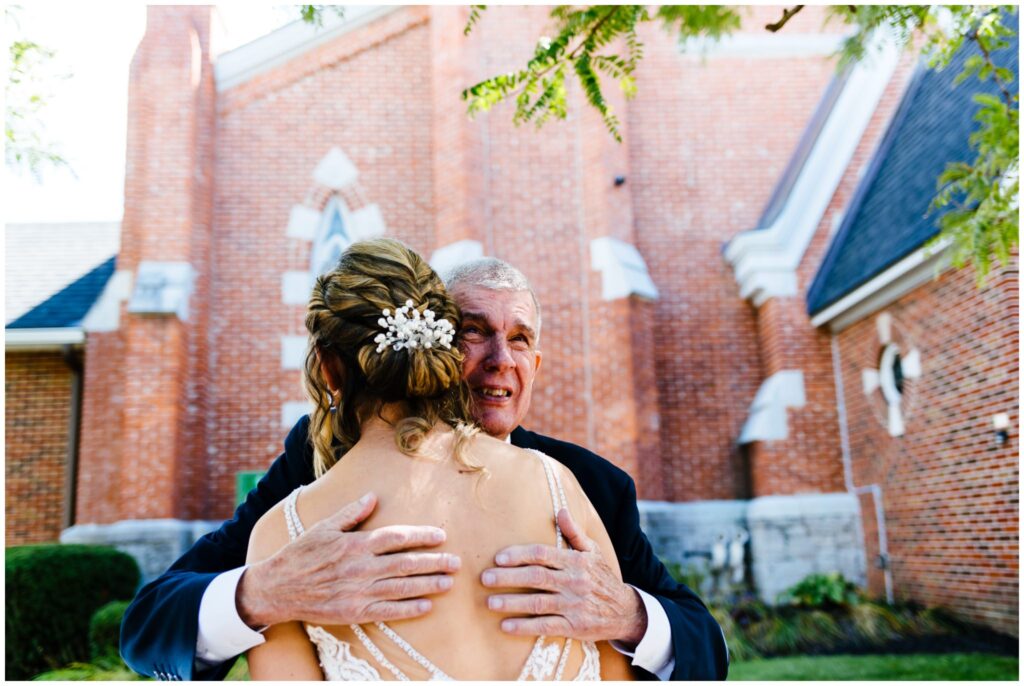 a bride and her father see each other for the first time on her wedding day at St. Pauls Church in Syracuse, NY