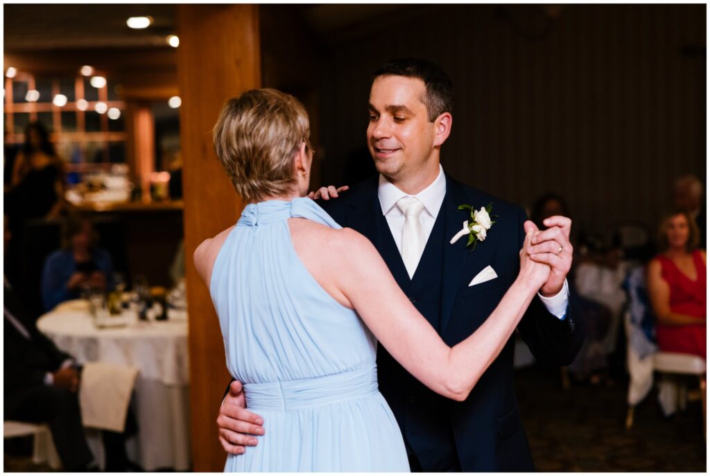 groom and his mother dance at his wedding reception.