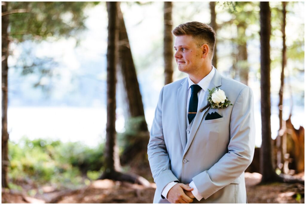 Groom is emotional during his first look at his adirondack wedding