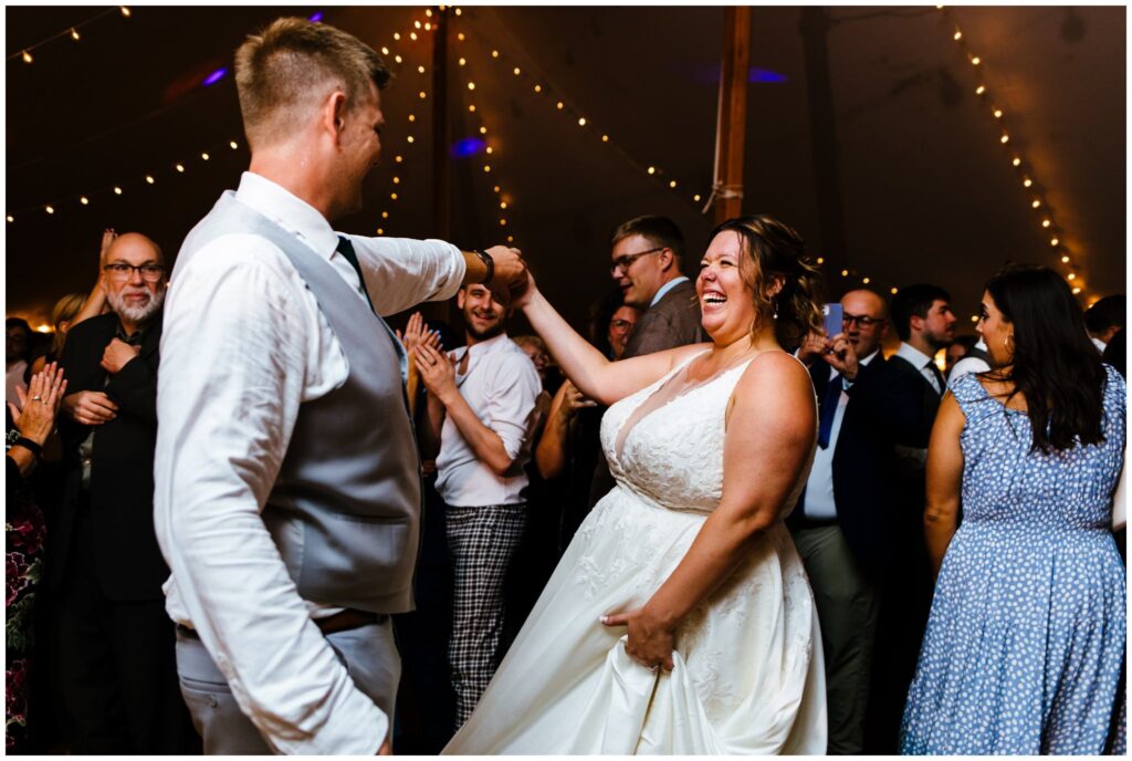 People dance and have fun at the camp gorham wedding in the adirondacks.