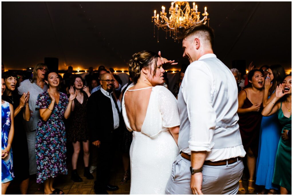 Bride and groom share a final dance at their adirondack wedding.