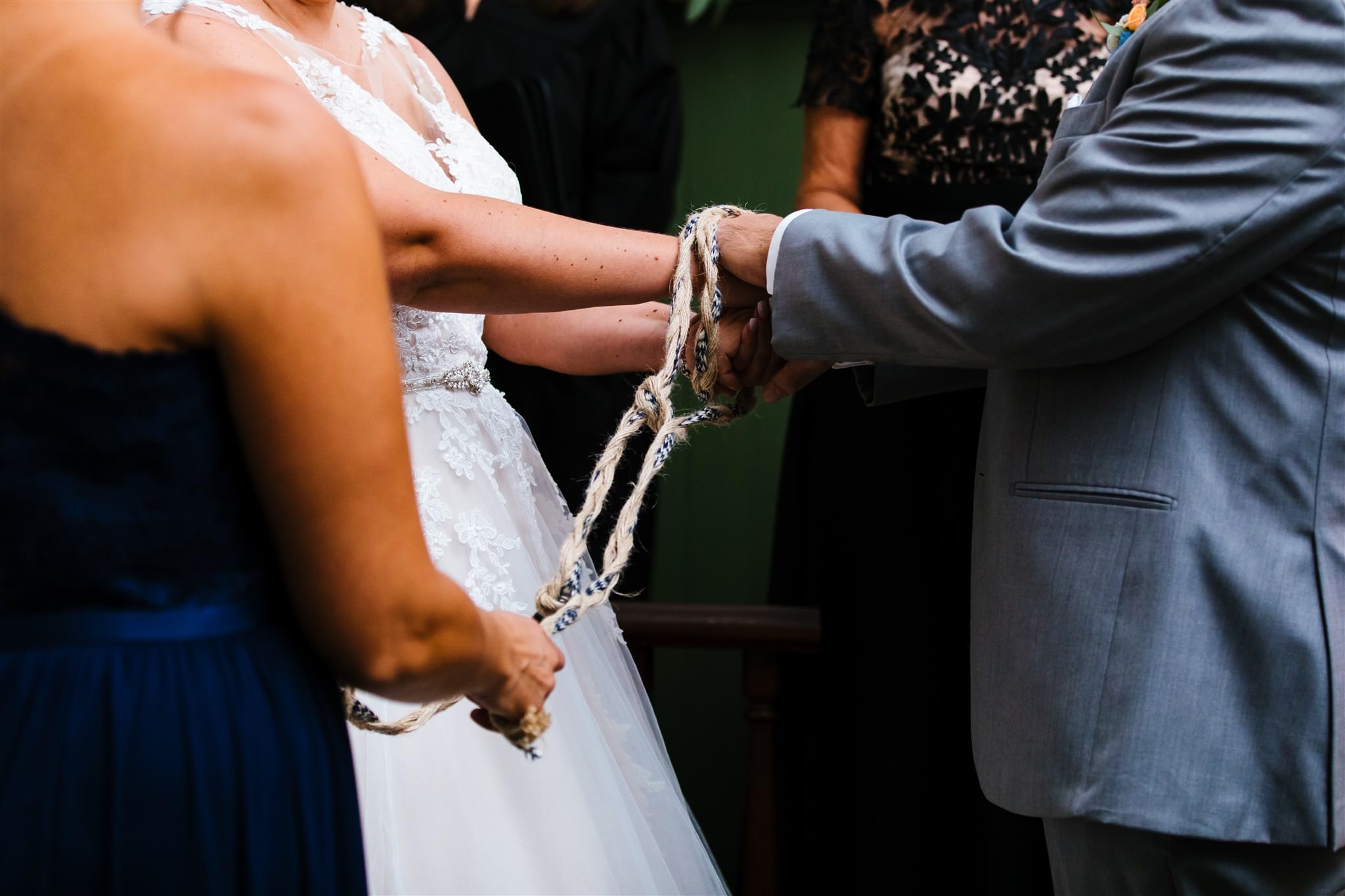A close up of a knot tying ceremony during a wedding at the Fontainebleau Inn.