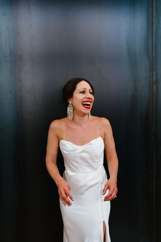Bride laughs in her vintage gown at her berkshires wedding.