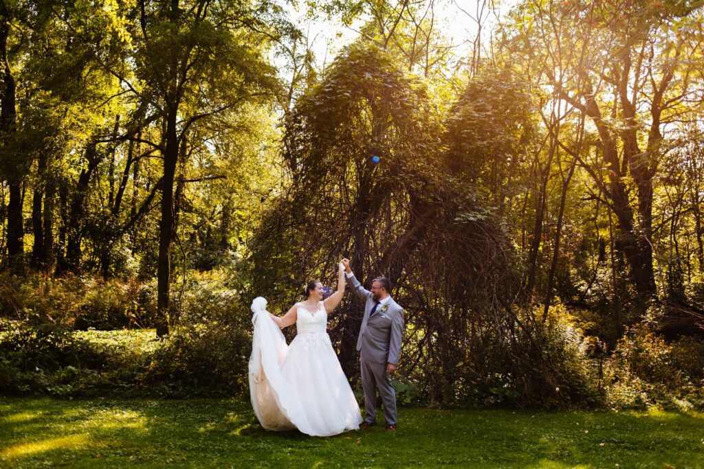 Bride and groom dance at their wedding which took place at a finger lakes wedding venues.