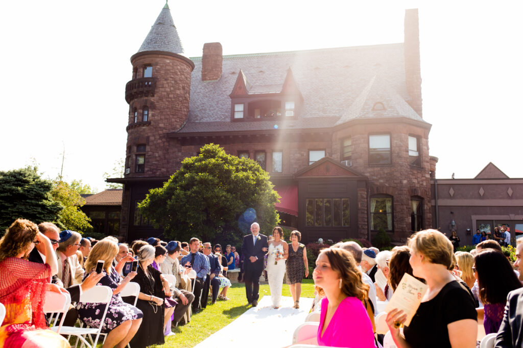 A bride gets married at belhurst castle, which is a gorgeous finger lakes wedding venues.