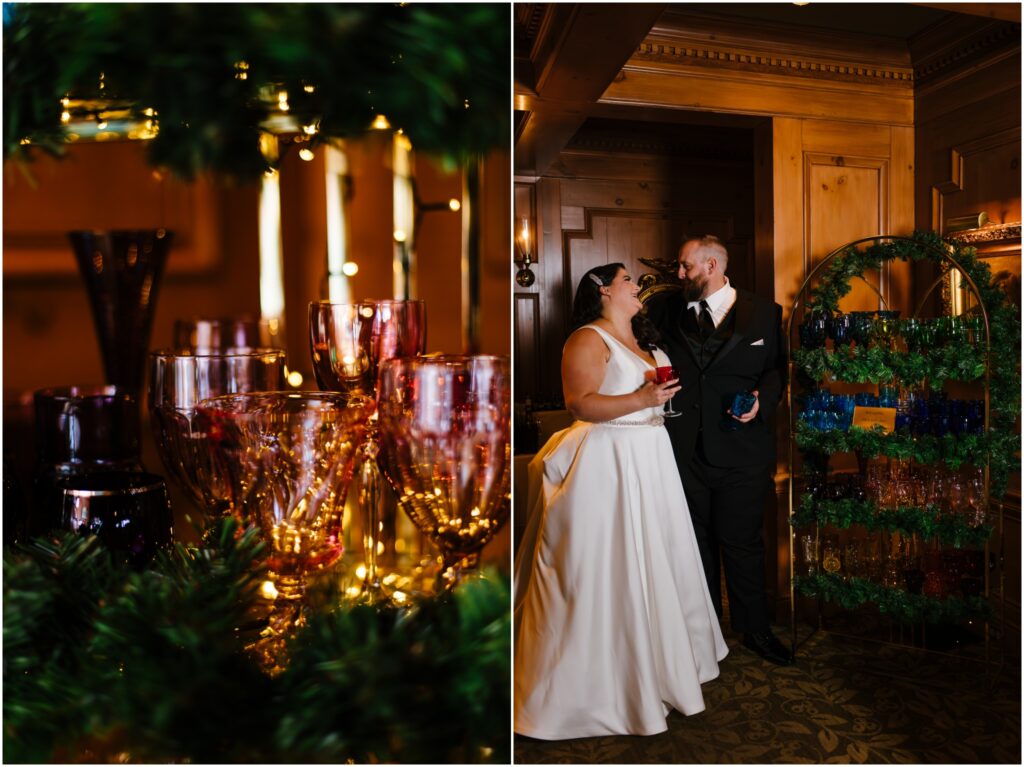 A bride and groom stand next to a display of jewel toned glassware at their Skaneateles wedding.