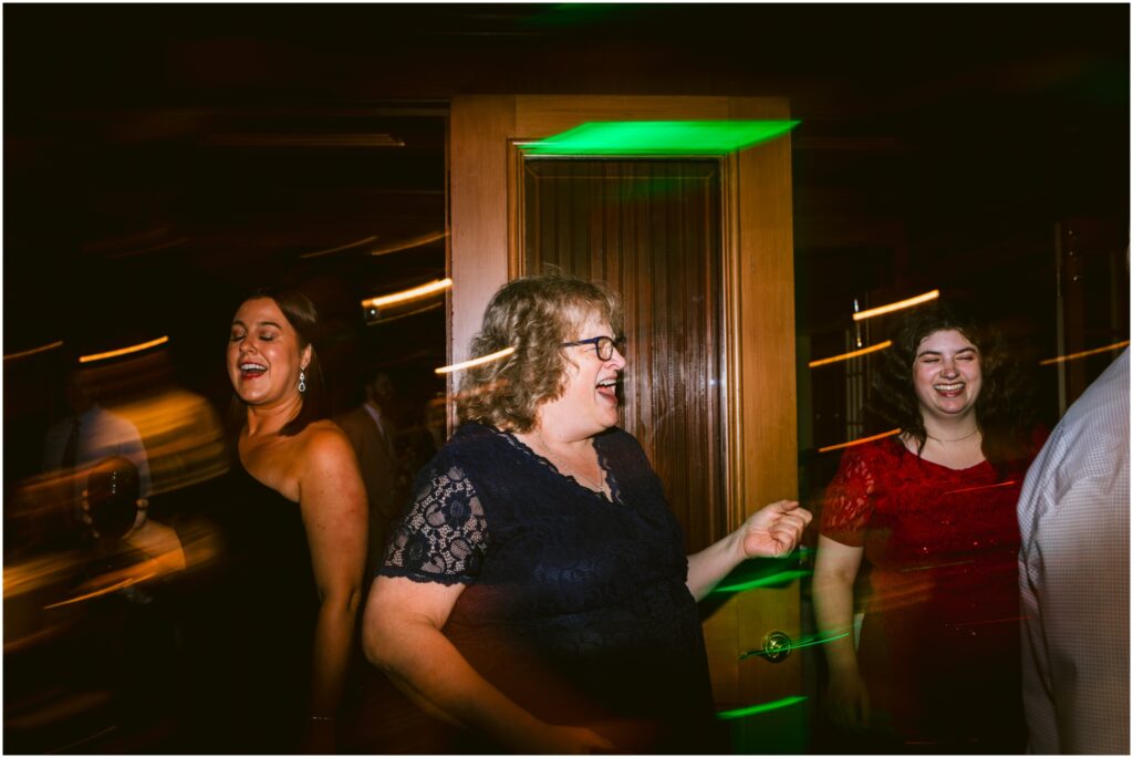 A wedding guest dances during the reception at the Sherwood Inn.