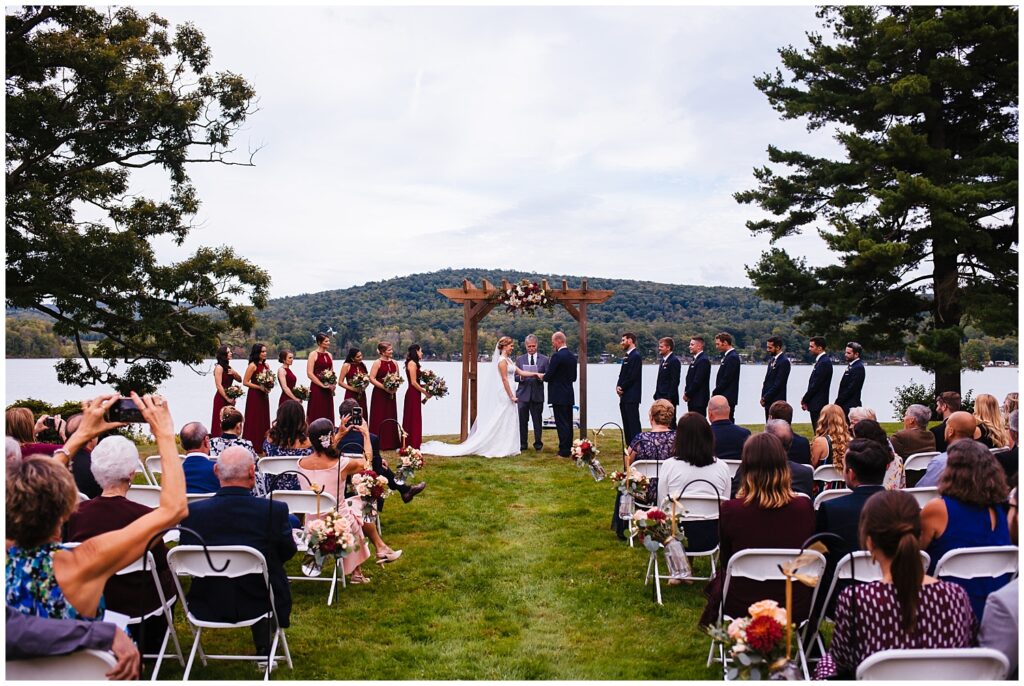 Bride and groom get married in front of a lake in upstate, NY.