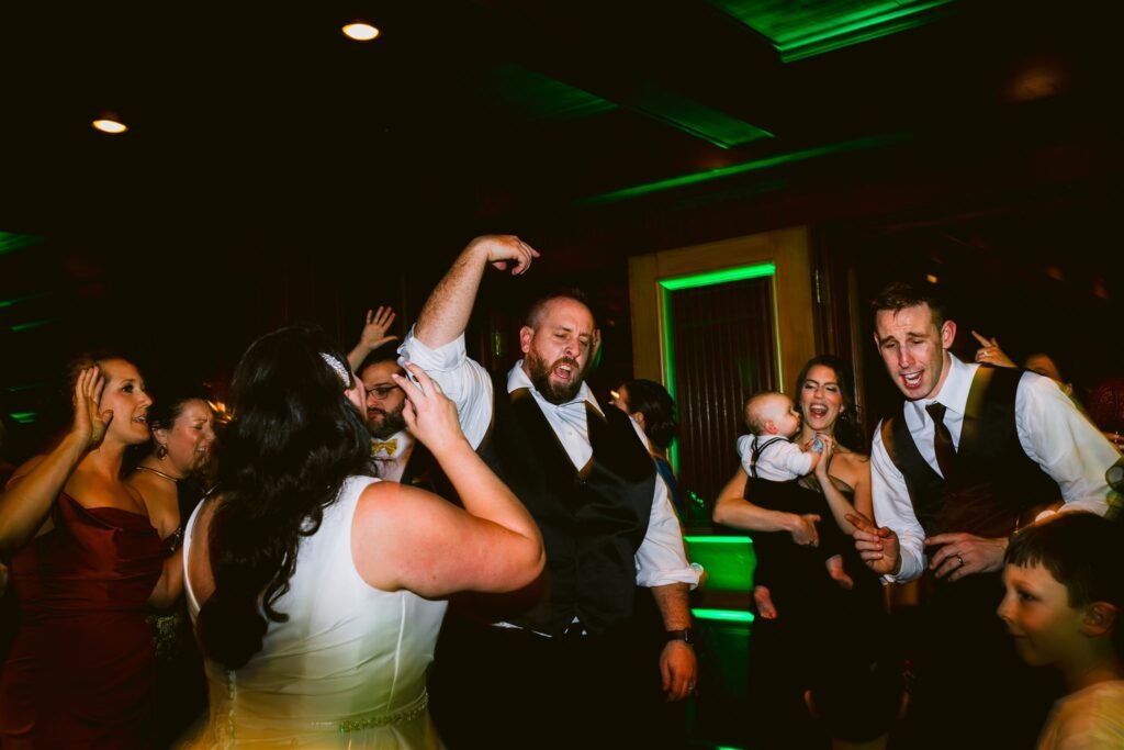 A bride and groom dance on their wedding day at the Sherwood Inn, which is one of a few beautiful finger lakes wedding venues. 