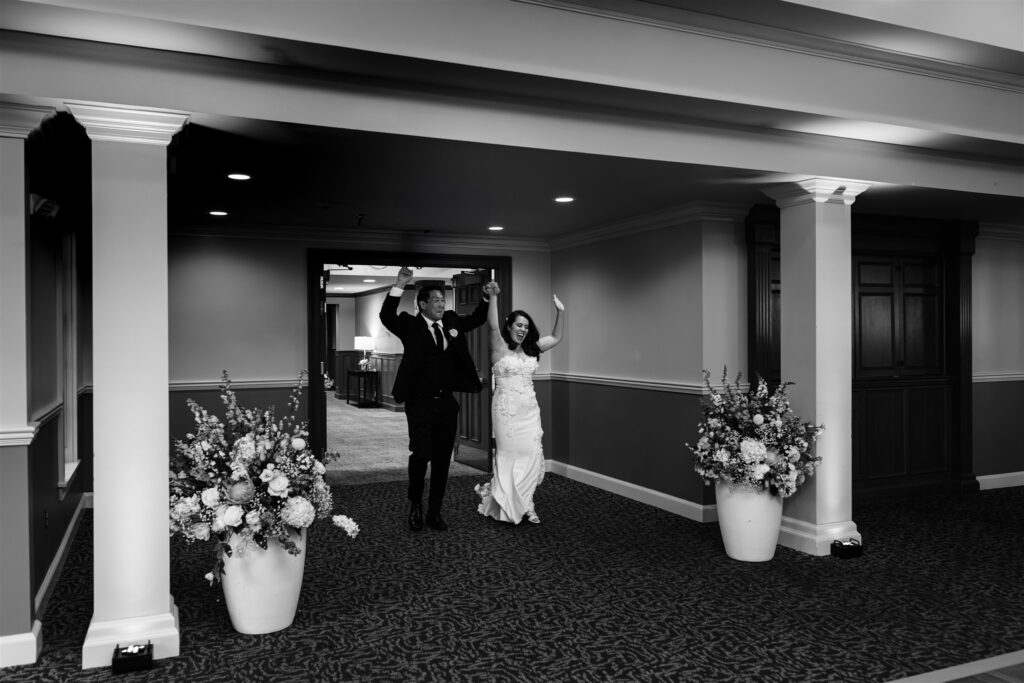 Bride and groom are introduced into their wedding reception. Photo by Rochester Wedding photographer calypso rae photography.