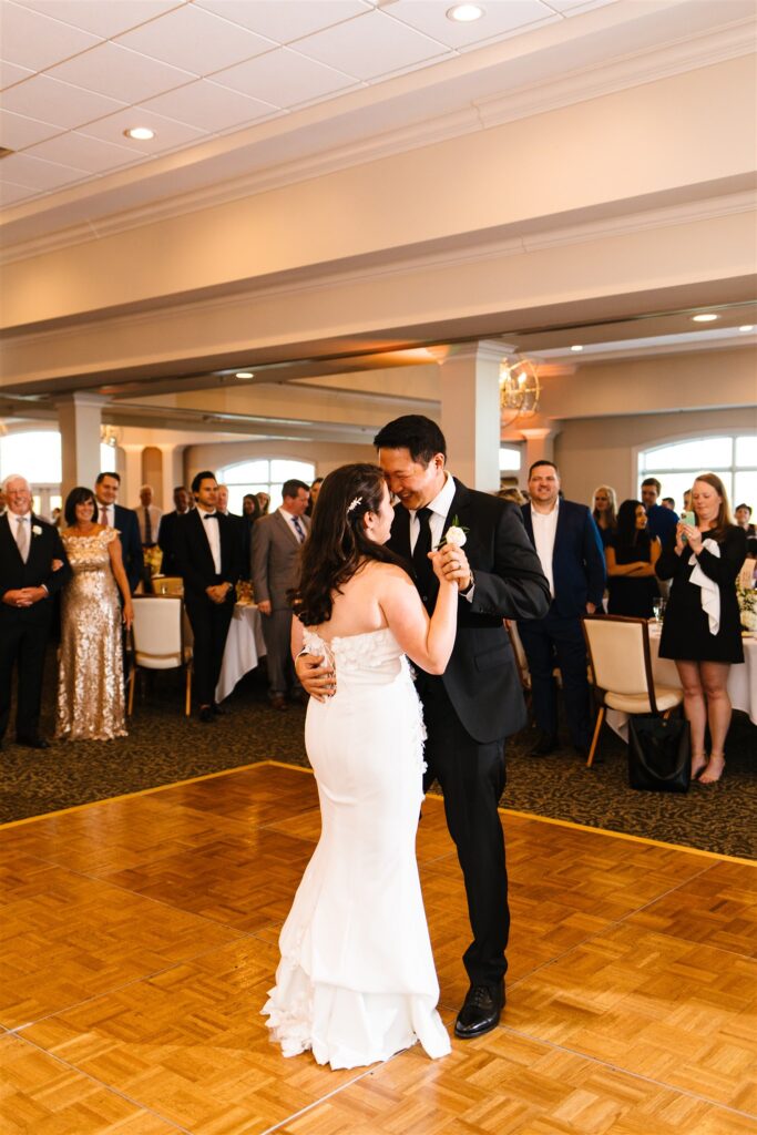 Bride and groom share a first dance at their locust hill country club wedding.