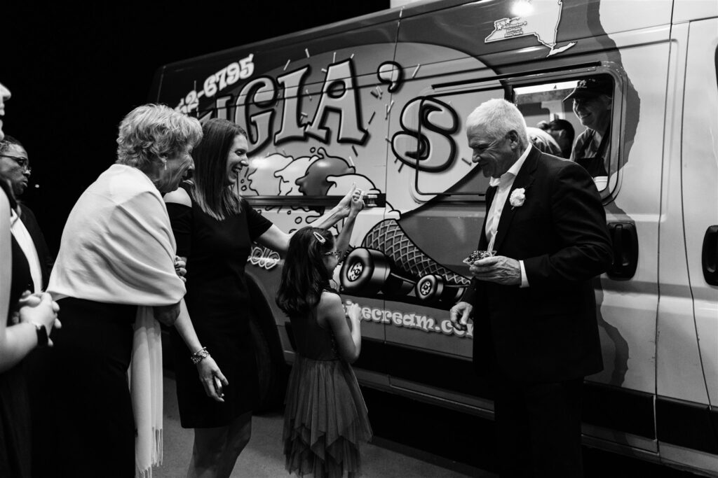 an ice cream truck delivers ice cream to wedding guests at a locust hill country club wedding in rochester, ny.