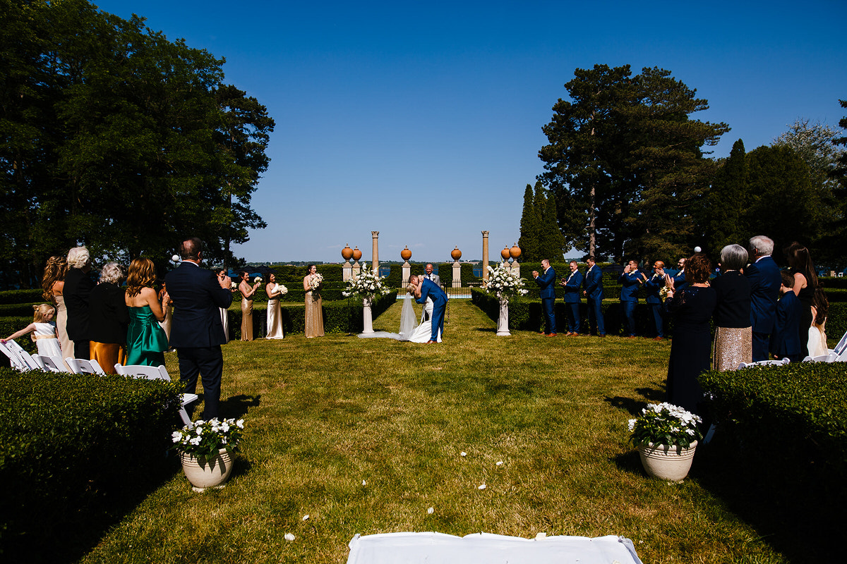 A couple during their first kiss at their Geneva on the Lake wedding.