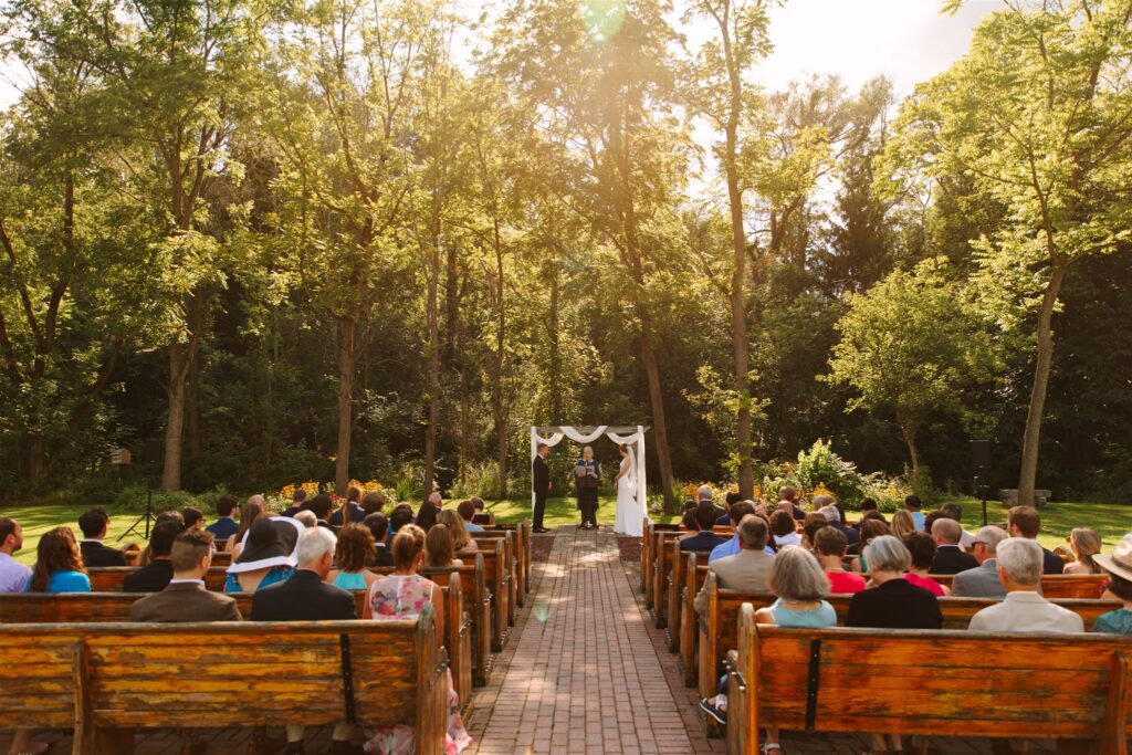 A bride and groom get married during golden hour at the Sinclair of Skaneateles.